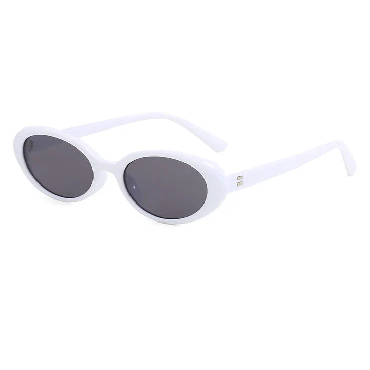 Oval-shaped women's sunglasses in a white and grey colour, offering UV protection and a stylish, retro-inspired design.