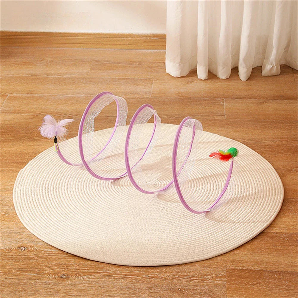 Folding cat play tunnel with various toys like balls, feathers, and mice attached to the sides