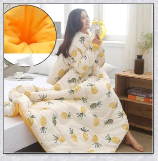 A cosy, wearable quilt with sleeves in a variety of colourful designs, perfect for staying warm and comfortable during the winter months.