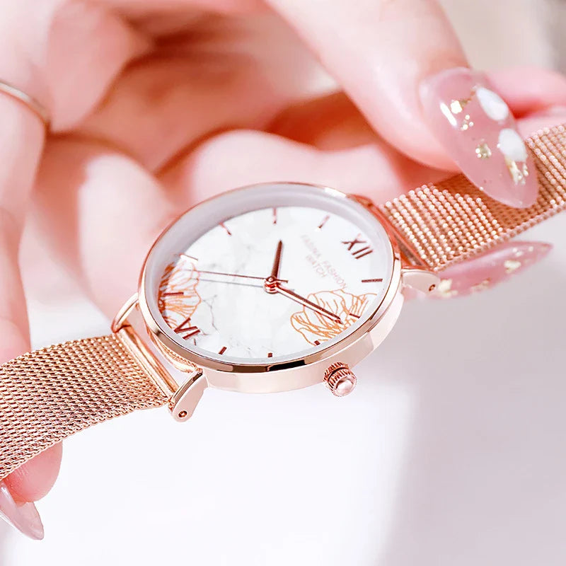 Elegant French ladies' fashion watch with stainless steel case and leather strap, featuring a white dial and classic design