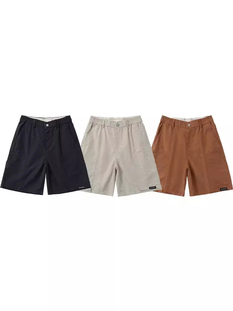 Premium men's quick-drying casual trousers in black, caramel, and sand colours with a relaxed, loose fit