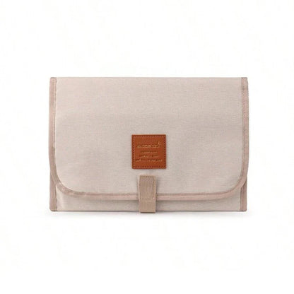 Premium waterproof changing pad for babies, featuring a compact, foldable design and soft, skin-friendly materials for a comfortable, hygienic nappy changing experience on the go.