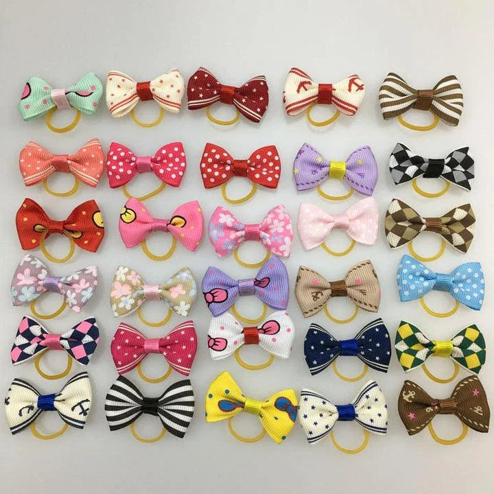 Colourful pet hair bows in assorted colours, made with premium ribbon and rubber for a secure and comfortable fit.