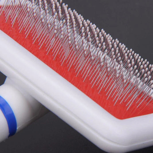 Premium pet grooming brush with stainless steel bristles, designed for gentle yet effective grooming of cats and dogs