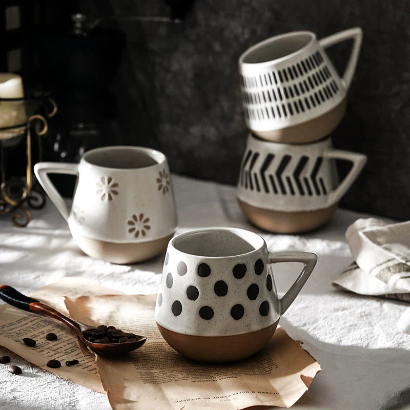 A hand-painted ceramic mug featuring a unique Nordic-inspired design, perfect for enjoying coffee, tea, or other beverages