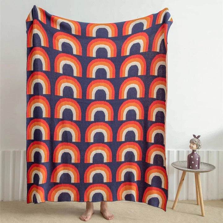 Cosy and vibrant 100% cotton knit throw blanket with a colourful rainbow pattern