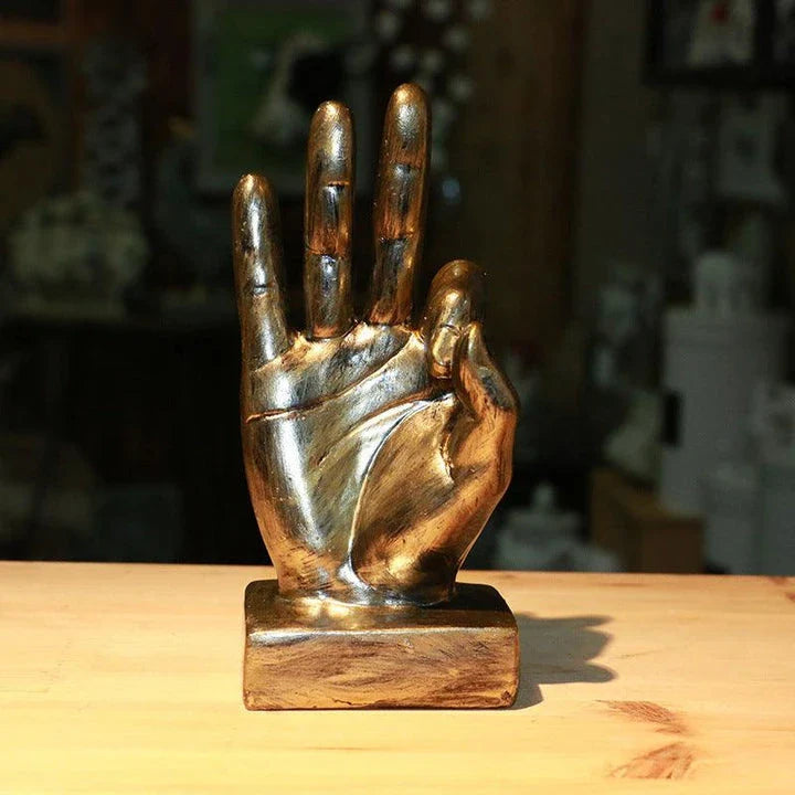 Elegant resin gesture ornaments in a variety of classic bronze and silver finishes, perfect for adding a charming accent to British-inspired home decor