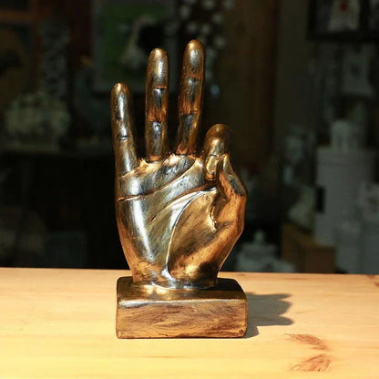 Elegant resin gesture ornaments in a variety of classic bronze and silver finishes, perfect for adding a charming accent to British-inspired home decor