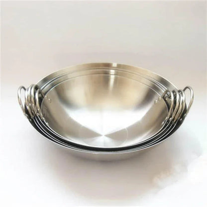 Premium British-made cast iron wok pan with superior heat retention and even heat distribution for versatile cooking