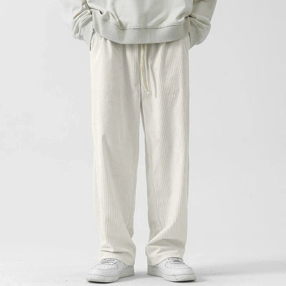 Premium fleece-lined corduroy trousers in a range of versatile colours, featuring a relaxed, straight-leg silhouette for a sophisticated, comfortable look.