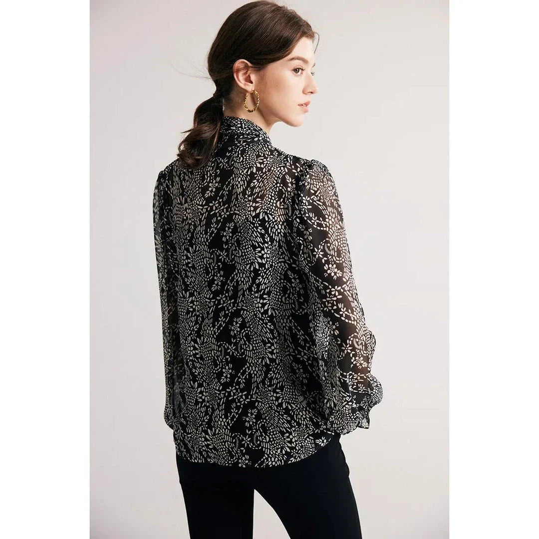 Elegant black silk blouse with unique bow collar, designed for a flattering fit and all-day comfort.