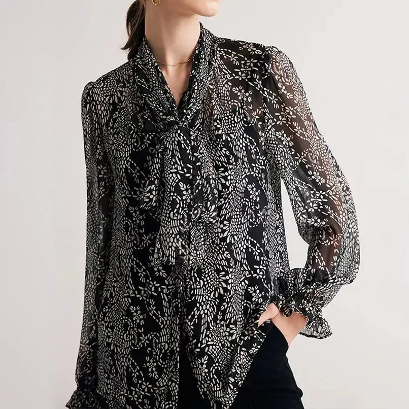 Elegant black silk blouse with unique bow collar, designed for a flattering fit and all-day comfort.