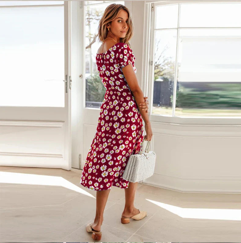 Elegant floral square collar dress with cinched hem, available in navy blue, green, and red colours