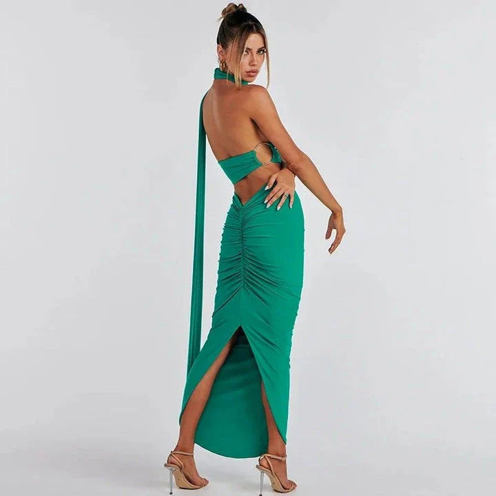Glamorous backless cocktail dress set with halter-neck crop top and flowing maxi skirt in green colour