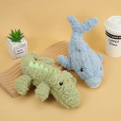 Plush crocodile-shaped squeaky dog toy made of durable, bite-resistant fleece material