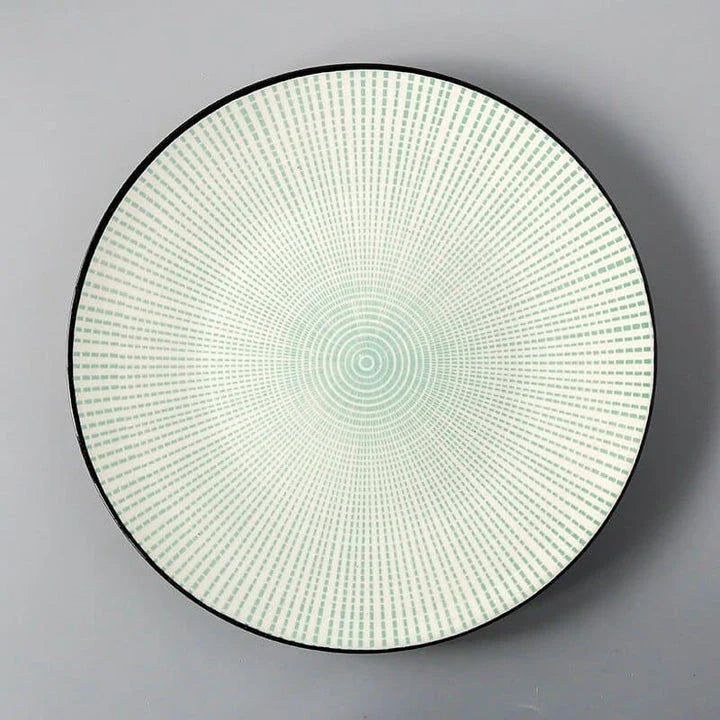 Elegant ceramic plates with vibrant, whimsical prints in a variety of enchanting designs