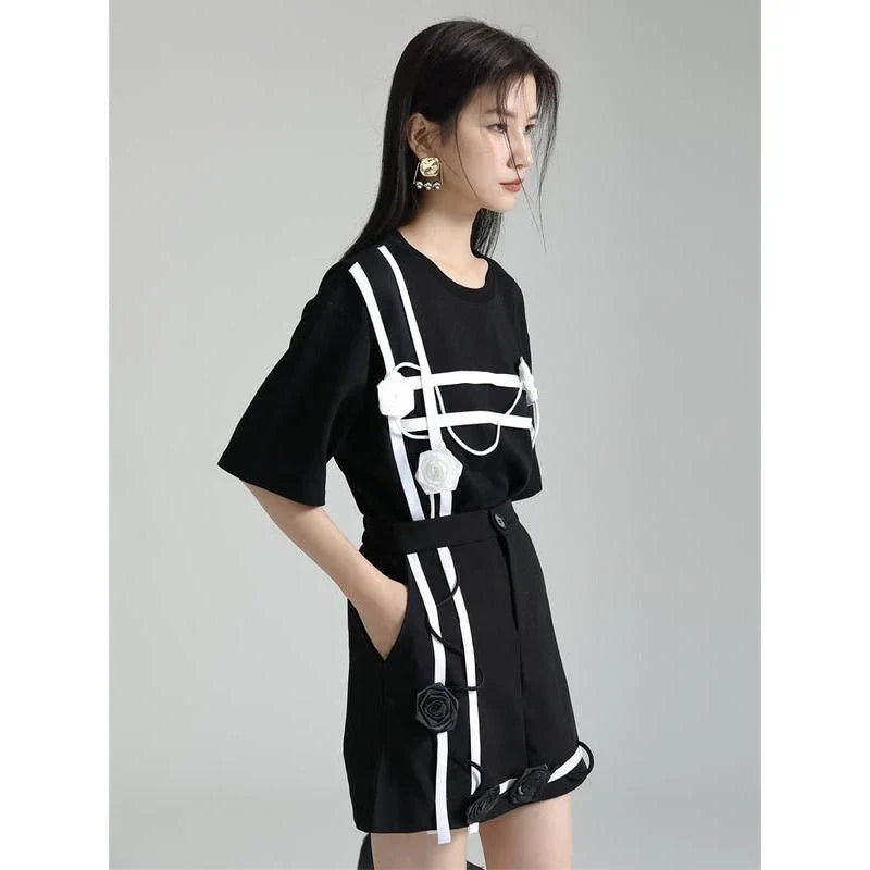 A stylish black and white floral half-sleeve casual t-shirt with a classic round neckline, perfect for everyday wear.