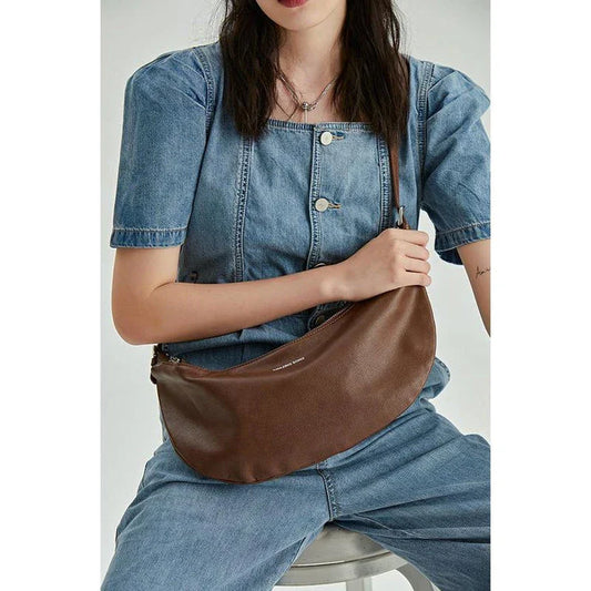 Stylish leather crossbody fanny pack with vintage half-moon design, perfect for everyday use in the UK