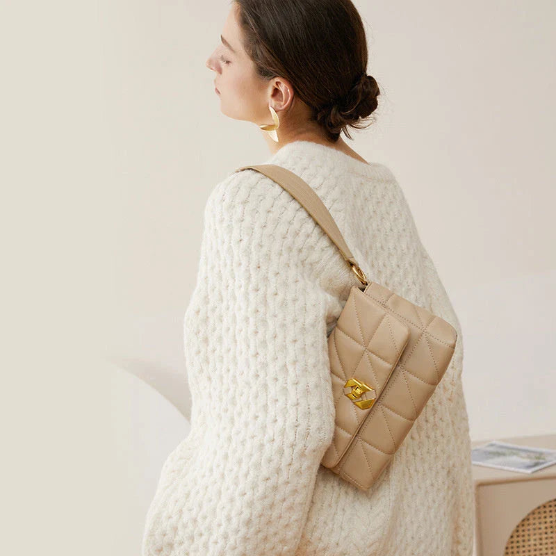 Premium genuine leather crossbody bag in a classic white colour, featuring an adjustable strap and a spacious interior with a zipper pocket.
