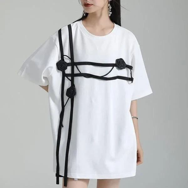 A stylish black and white floral half-sleeve casual t-shirt with a classic round neckline, perfect for everyday wear.