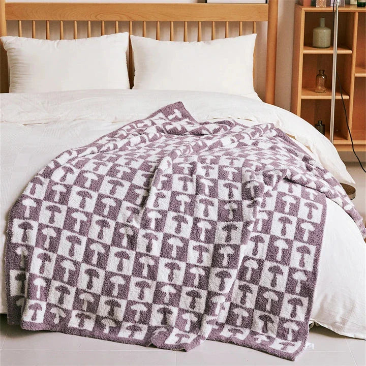Cosy two-tone checkerboard plaid knitted throw blanket in various colours, including red, blue, grey, and purple