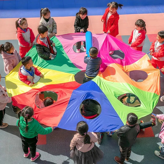 Vibrant rainbow-coloured parachute umbrella game for outdoor group activities and events