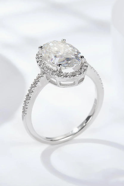 Elegant 4.5 carat moissanite halo ring in sterling silver with platinum plating, showcasing a captivating centre stone and delicate gem-studded design