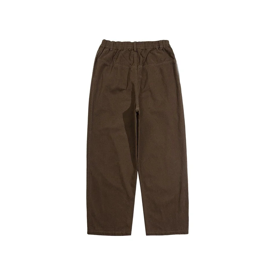Sophisticated men's casual trousers in various colours, featuring a tailored straight-leg design and mid-rise waistline for a polished, British-inspired look.