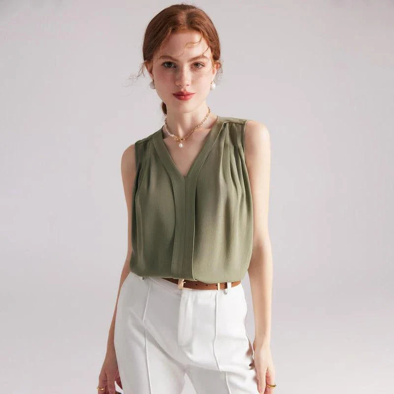 Elegant sleeveless silk blouse in a vibrant blue colour, designed for a sophisticated summer style