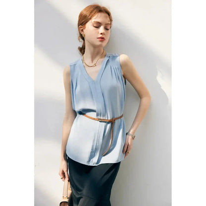 Elegant sleeveless silk blouse in a vibrant blue colour, designed for a sophisticated summer style
