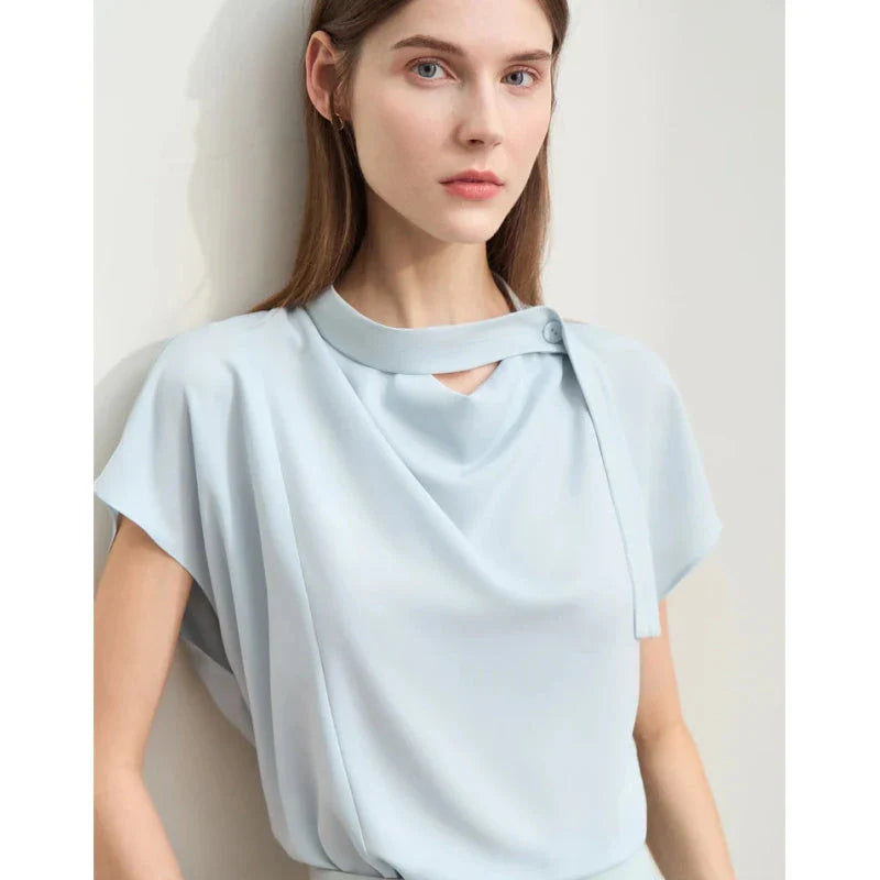 Elegant minimalist women's summer blouse in blue chiffon fabric with tie sleeves and hollow-out decoration