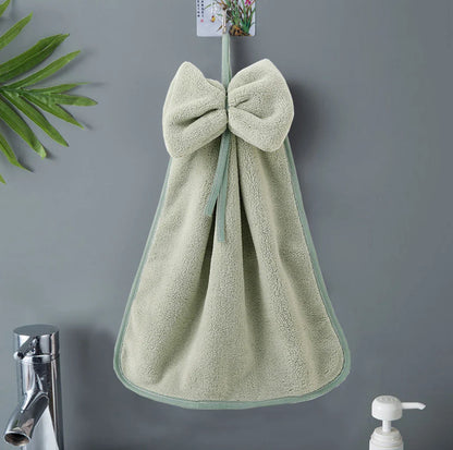 Elegant coral fleece hand towels with a unique bow design, perfect for kitchen and bathroom use