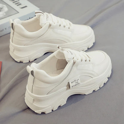 Fashionable women's casual trainers in beige and white colours, featuring a sporty yet chic design for everyday wear.