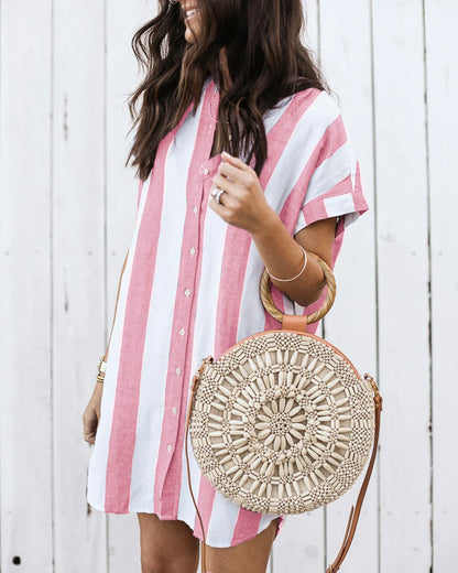 Casual striped short sleeve shirt dress in pink and blue colours, featuring a relaxed, flowing silhouette and button-down closure