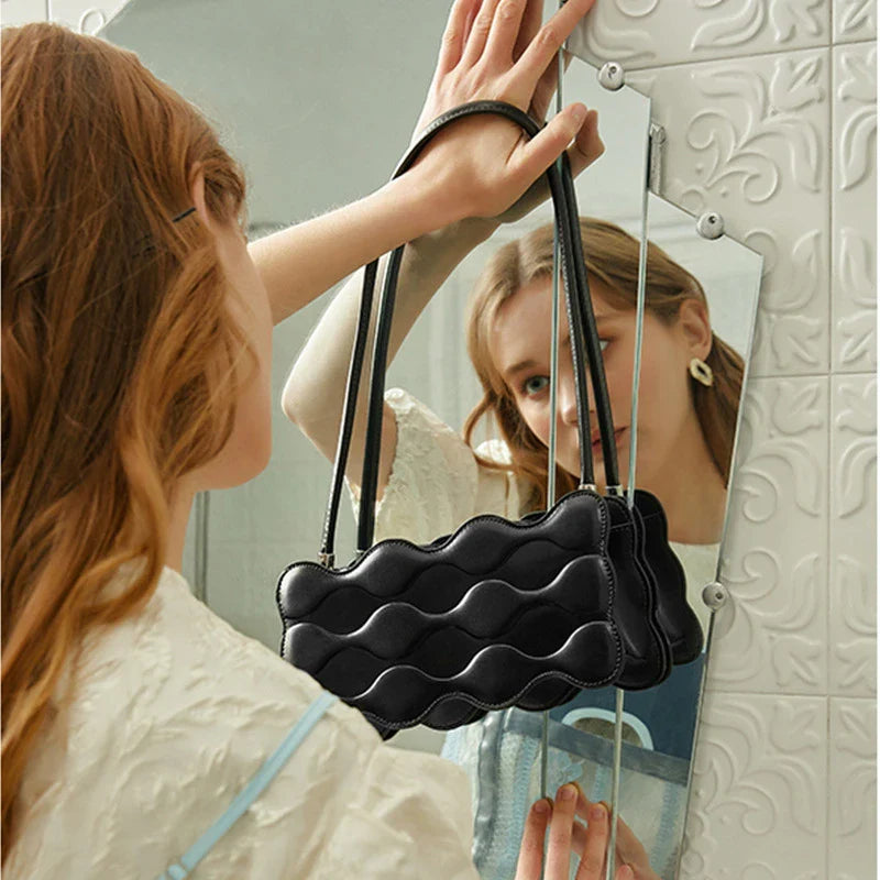 Premium embossed pearl chain handbag in fashionable shades with a soft, comfortable handle for hands-free carrying