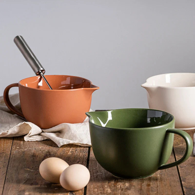 Premium porcelain mixing bowl with ergonomic handle and pointed drainage design for easy baking at home