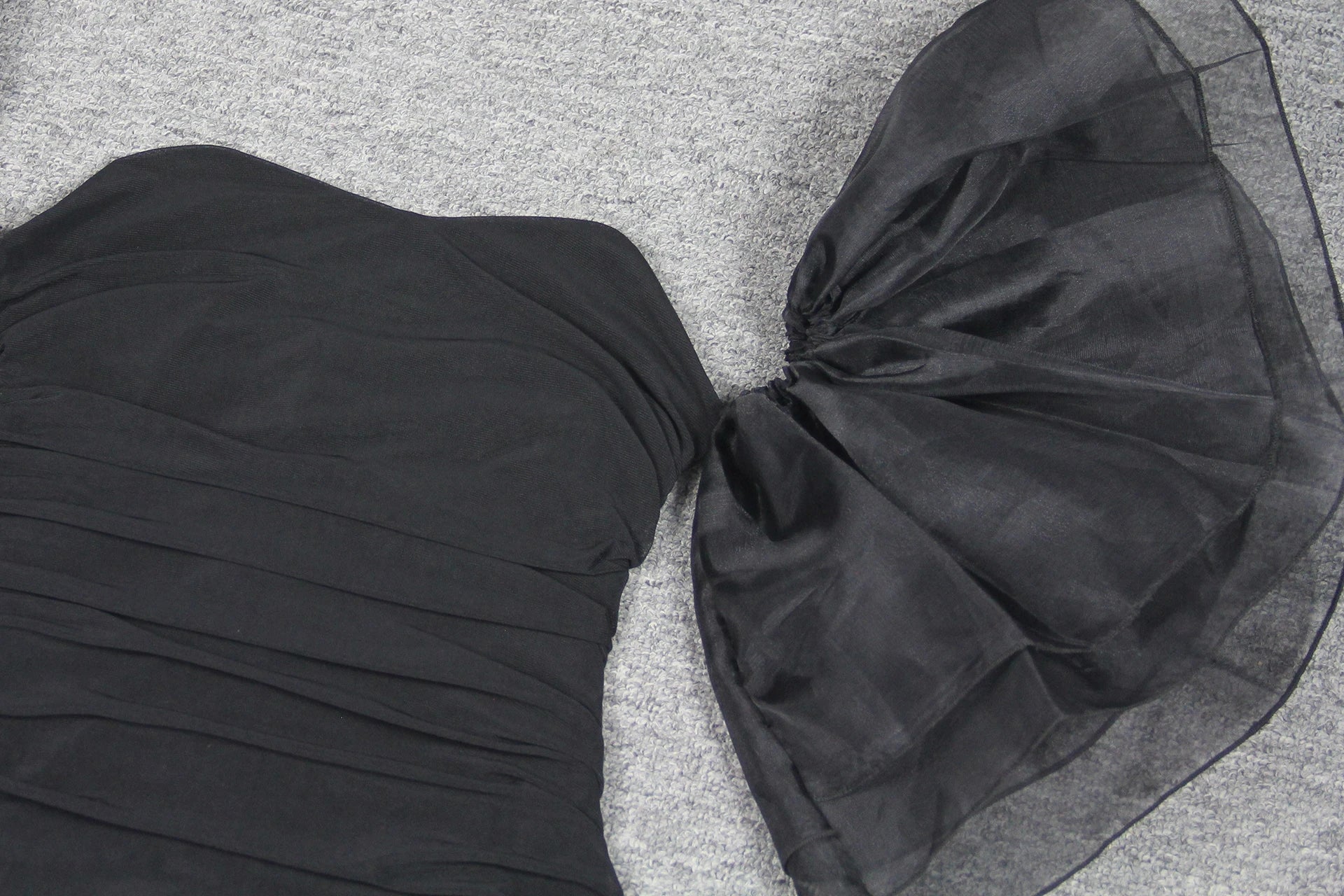 Elegant puff sleeve mesh dress with a flattering short, irregular skirt in white and black colours