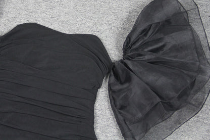 Elegant puff sleeve mesh dress with a flattering short, irregular skirt in white and black colours