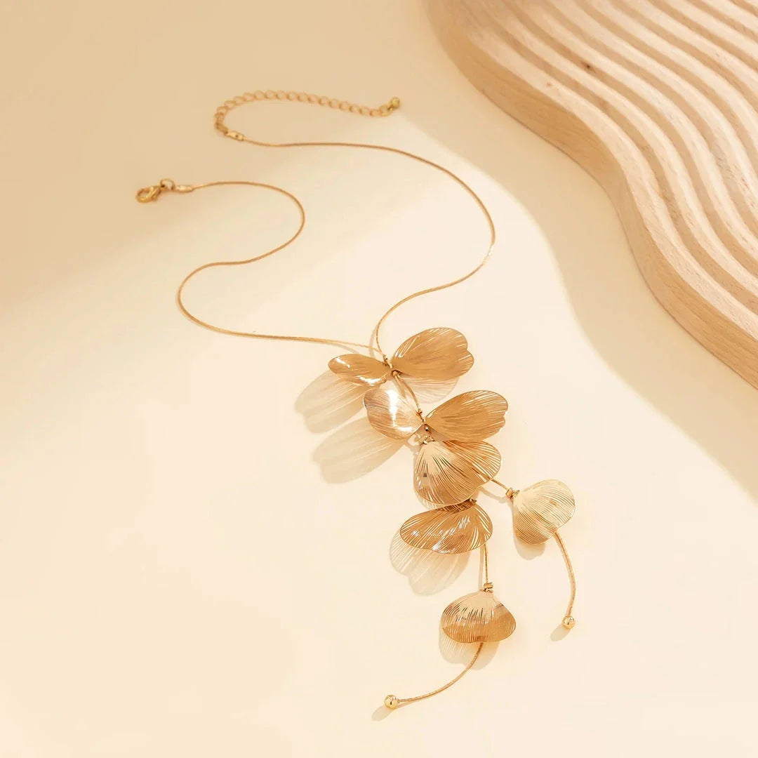 Elegant Kpop-inspired flower petal choker necklace in radiant gold colour, featuring a beautiful pendant and chic snake chain design