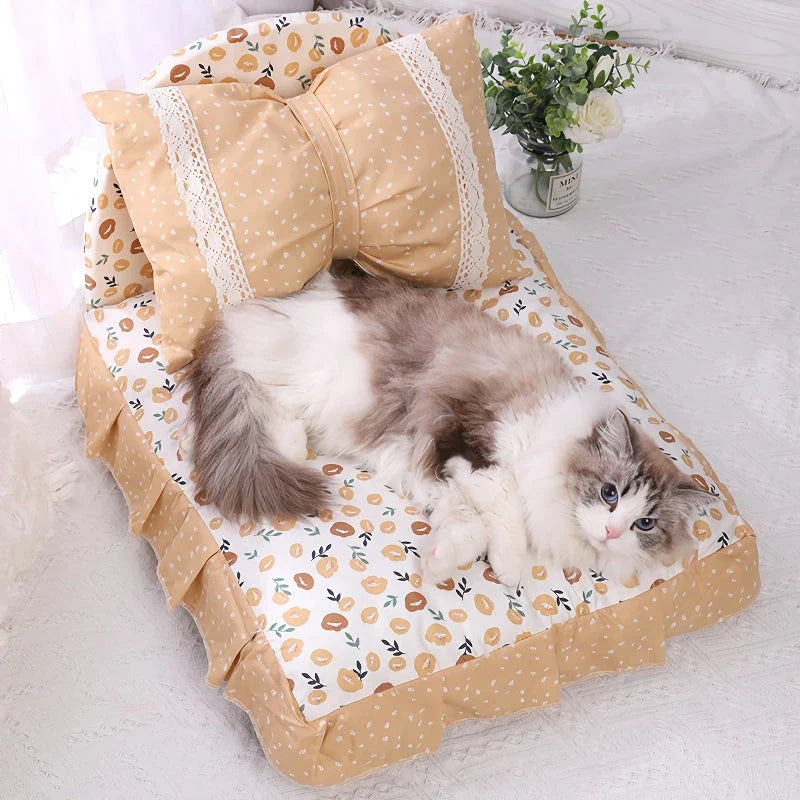Cosy bow-accented pet bed with a detachable cushion, providing a luxurious and stylish sleeping retreat for small to medium-sized dogs and cats.