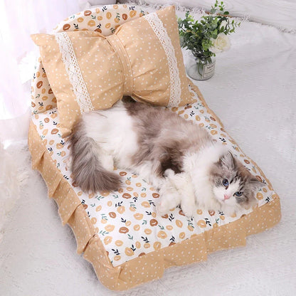 Cosy bow-accented pet bed with a detachable cushion, providing a luxurious and stylish sleeping retreat for small to medium-sized dogs and cats.
