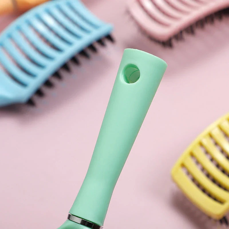 Women's Wet Curly Detangling Hair Brush with ergonomic design and flexible bristles for effortless styling and detangling of curly hair