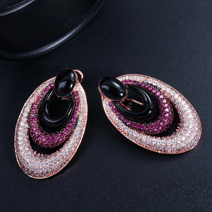 Elegant water drop-shaped ear studs in a vibrant red hue, adorned with a micro-inlaid zircon gemstone for a dazzling, sophisticated look.