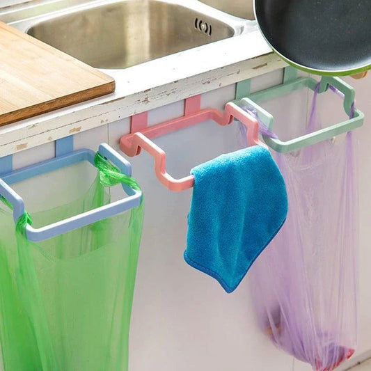 Cupboard-mounted trash bag holder in various colours for organising kitchen waste storage