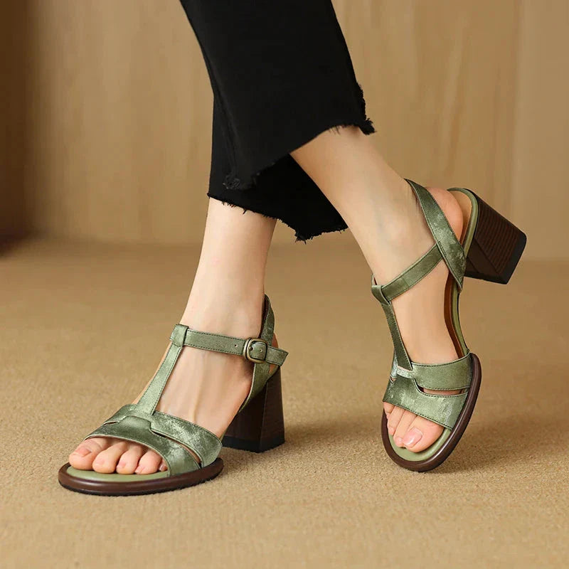 Genuine leather gladiator sandals with chunky heel, open-toe design, and secure buckle closure for summer style and comfort.