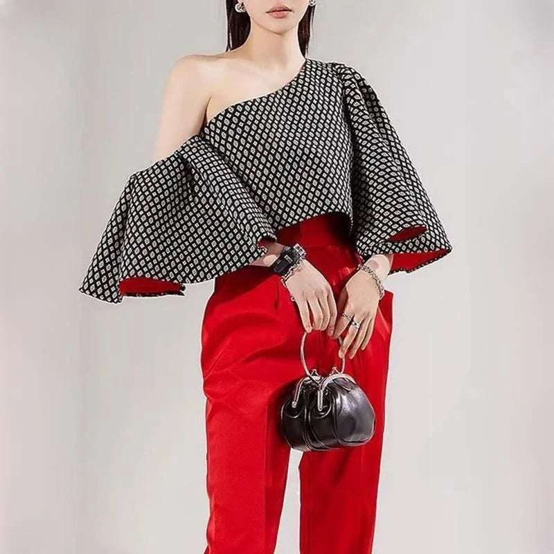 Elegant off-shoulder blouse with butterfly sleeves and vibrant printed pattern
