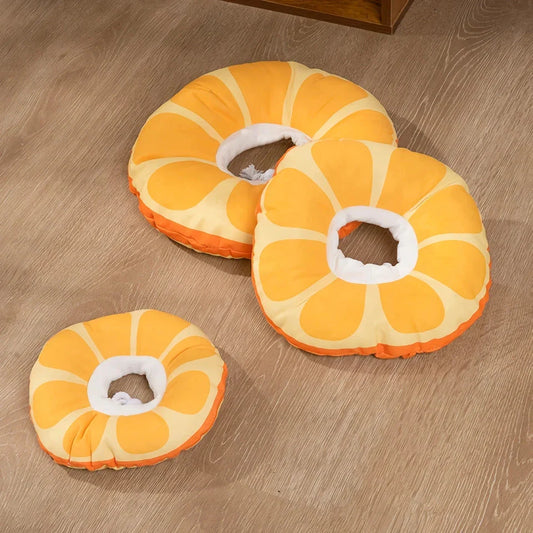A vibrant orange fruit-shaped recovery collar for cats, designed to protect and comfort your pet during their healing process.