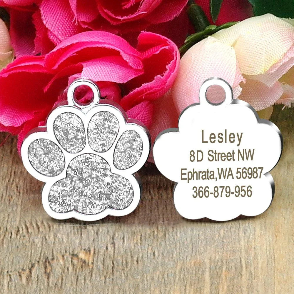 Paw-shaped pet ID tag with rhinestone embellishments, designed for safety and style