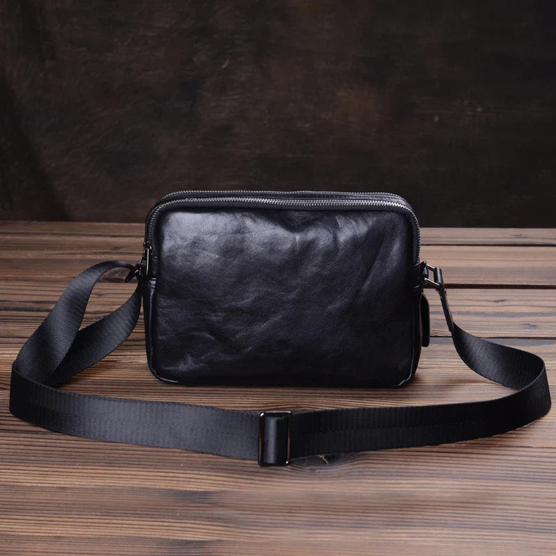 Handmade premium leather shoulder bag for men, featuring a cross-body design and retro-inspired style
