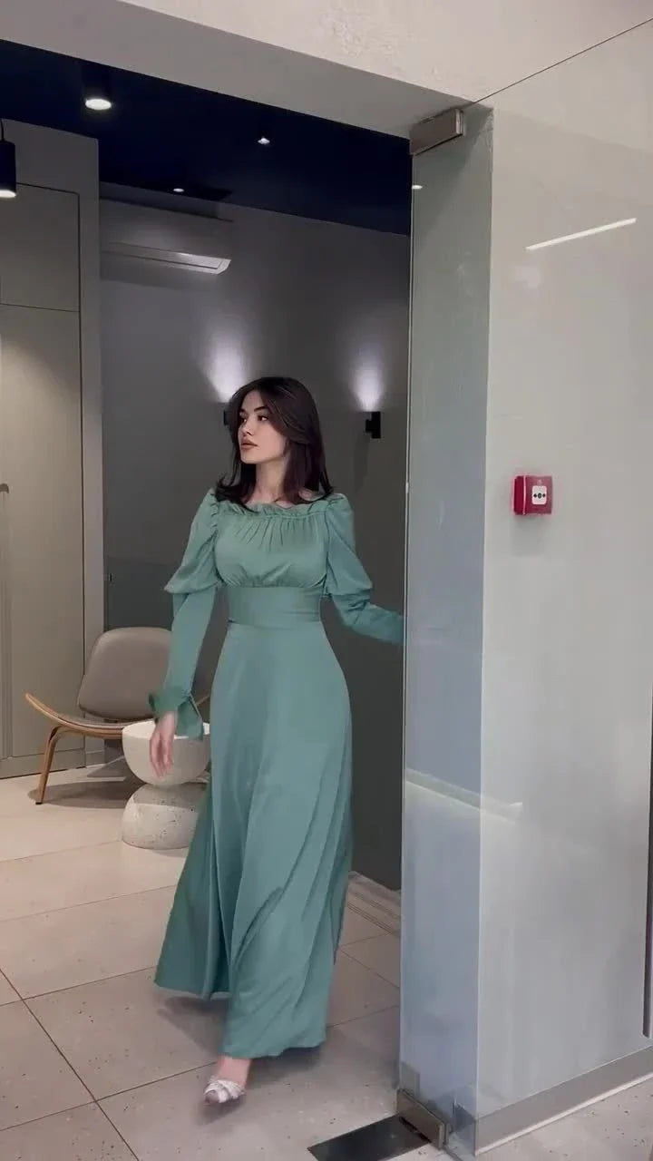 Elegant blue bubble collar dress with wooden buttons and a cinched waist, perfect for formal and casual occasions.